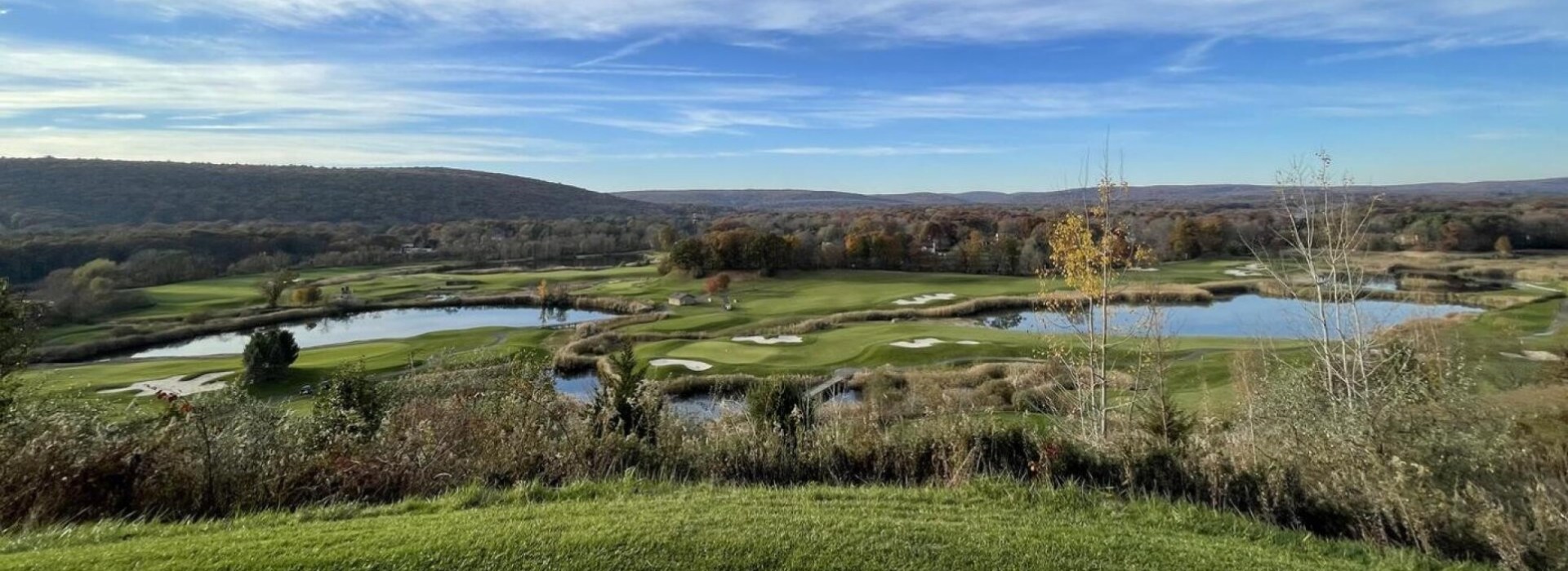 Golf Course overlook with mountains and lake